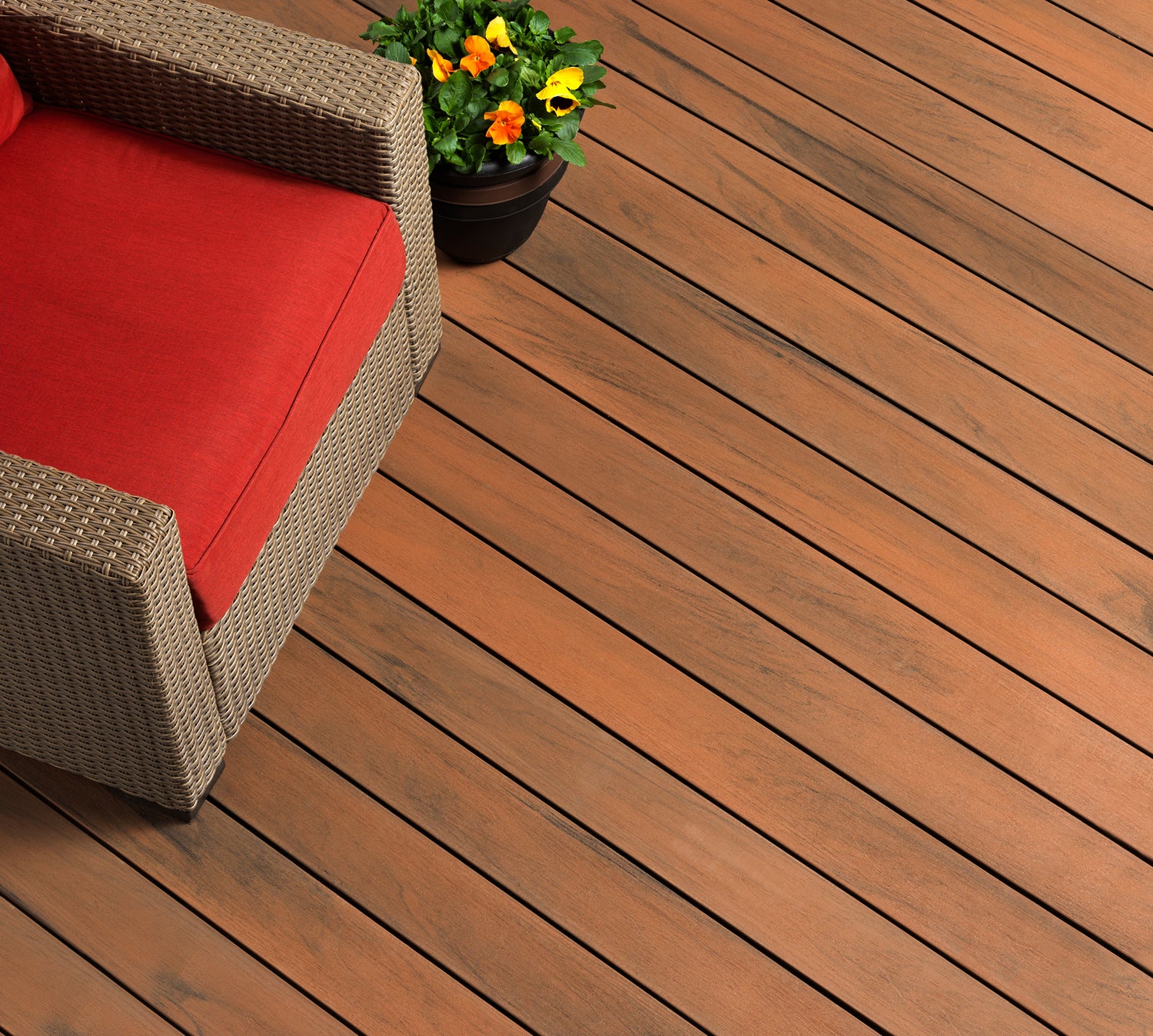 TruNorth Tigerwood deck with red wicker chair